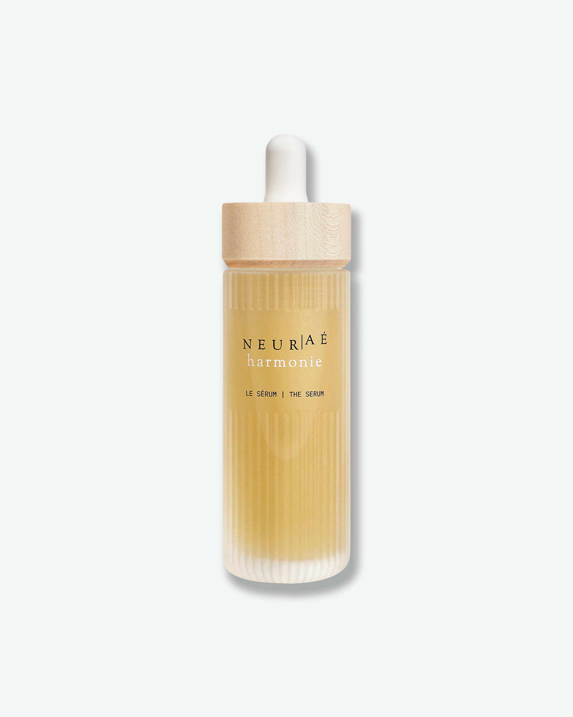 Neuriae serum bottle with wooden cap on a white background