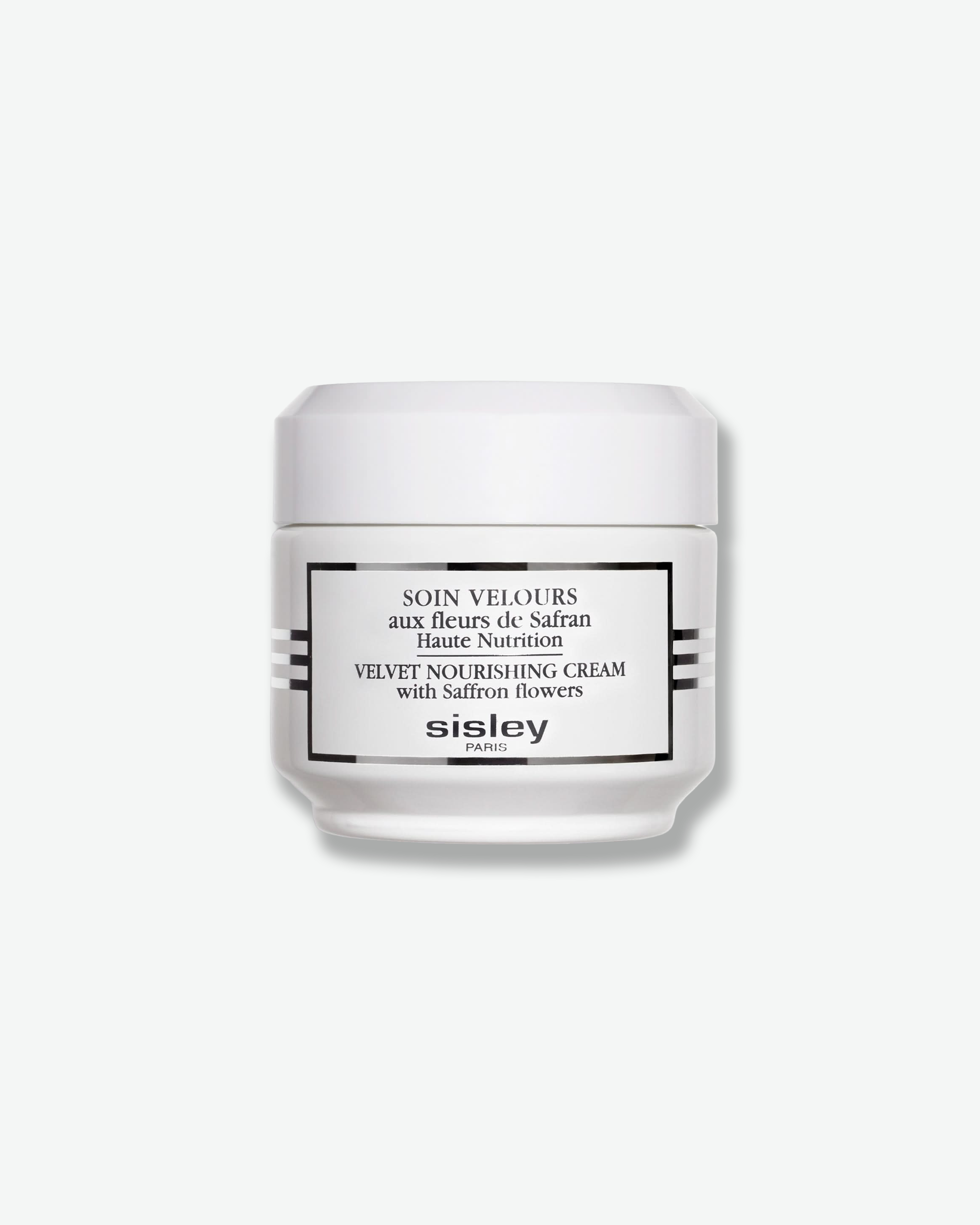 Front view of a Sisley Paris Velvet Nourishing Cream jar against a plain gray background. The opaque, glossy white cosmetic jar is accented by black horizontal stripes on the sides, a black-bordered rectangular label with product details, and a clean white cap.