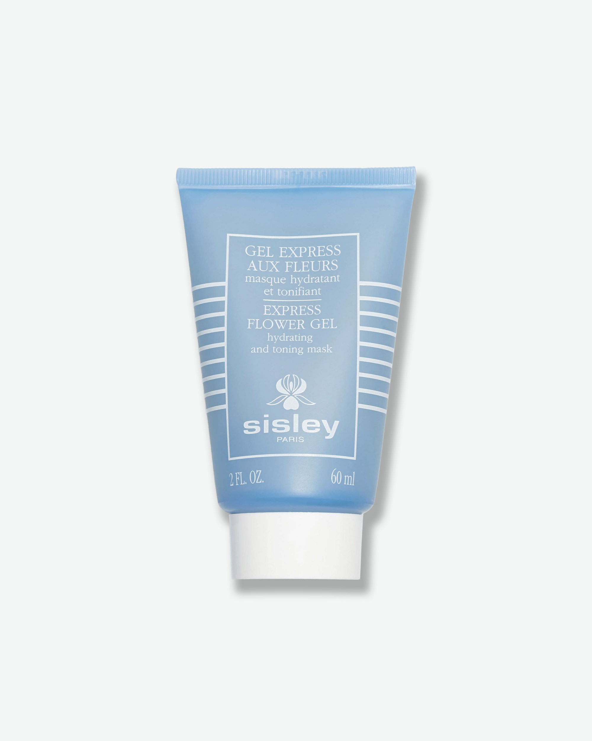 Front view of a Sisley Paris Express Flower Gel mask tube against a plain gray background. The vertical squeeze tube is a matte, soft periwinkle blue with white horizontal lines stacked on the sides, white product details centered in a frame, and a solid white screw cap.