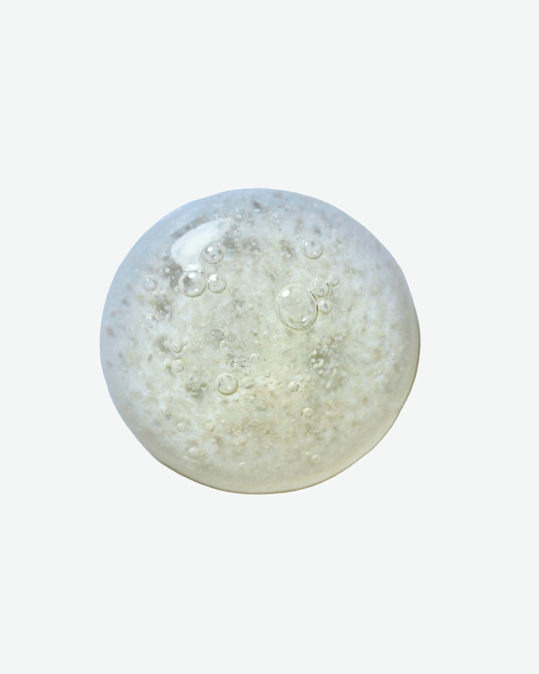 Clear gel-like substance with bubbles on a white background