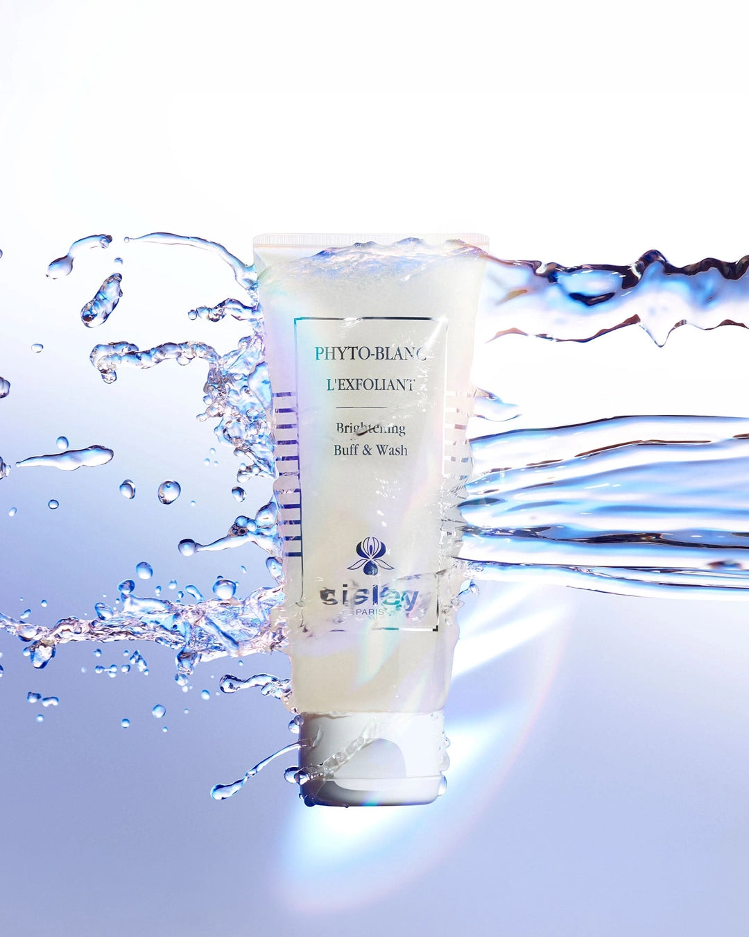 Tube of skincare product with water droplets on a light blue background