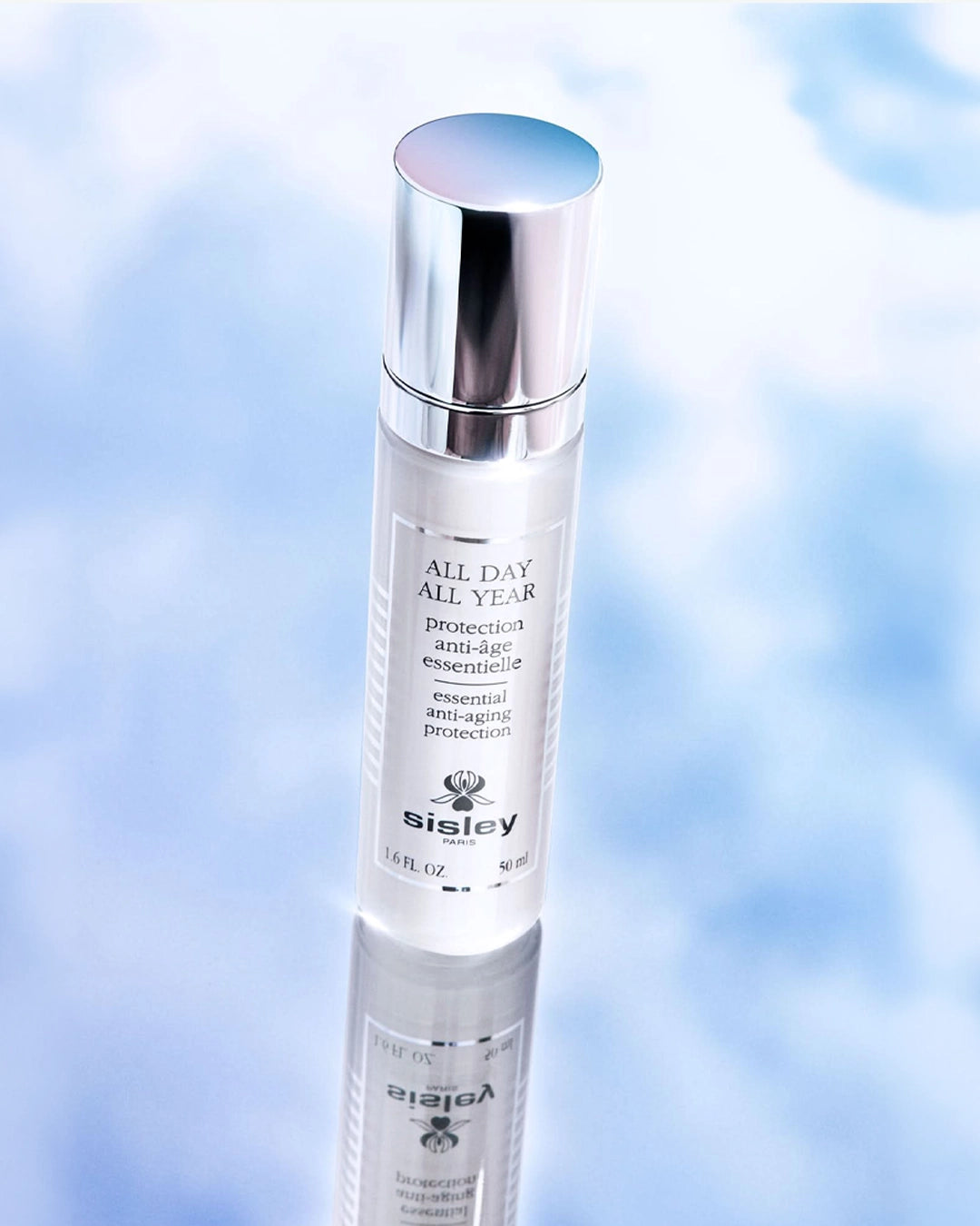 Sisley skincare bottle on a blue gradient background