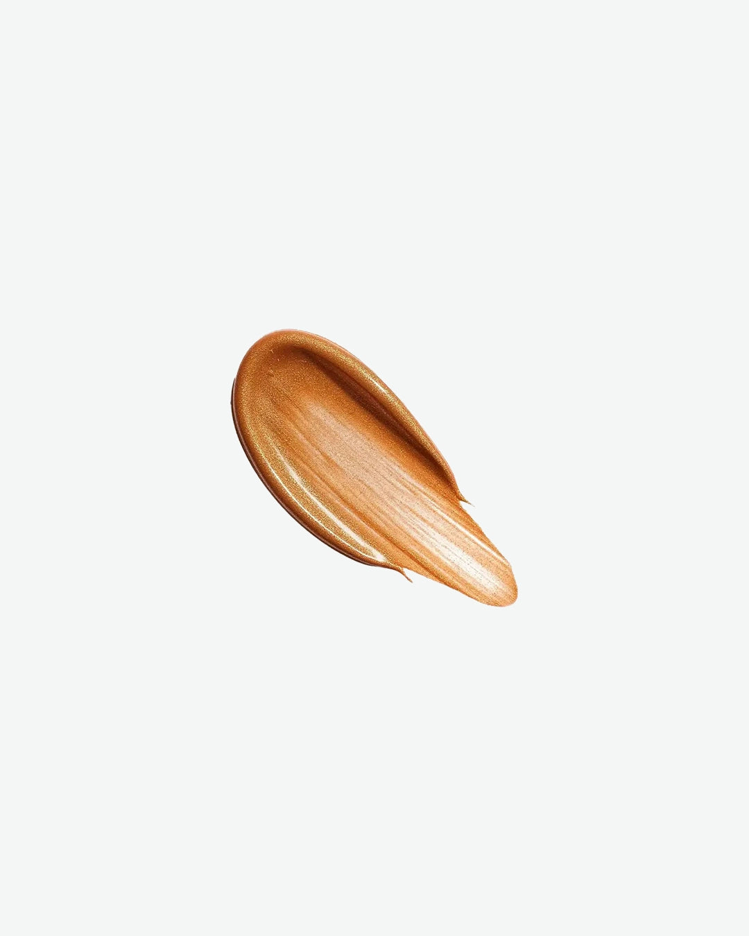 A smooth, thick swipe of Sisley Phyto-Touche Gel Glow on a clean white background, showcasing its rich, warm bronze hue and satin texture.