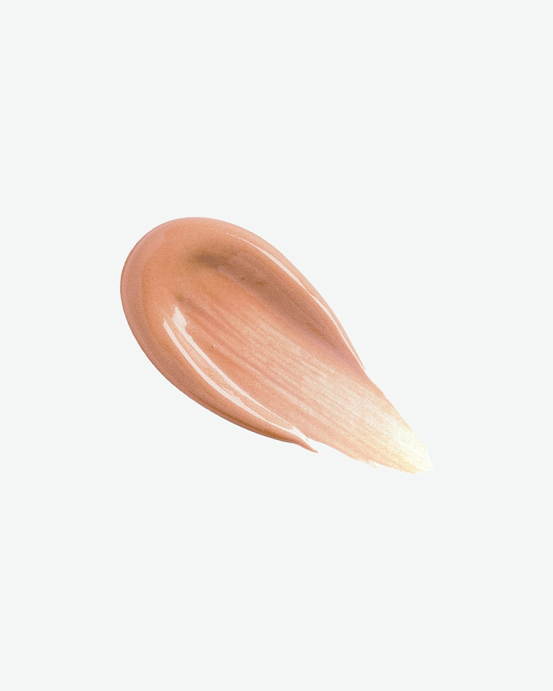A smooth, thick teardrop-shaped swipe of pearly bronze makeup primer showcasing its soft glowy texture against a light background.