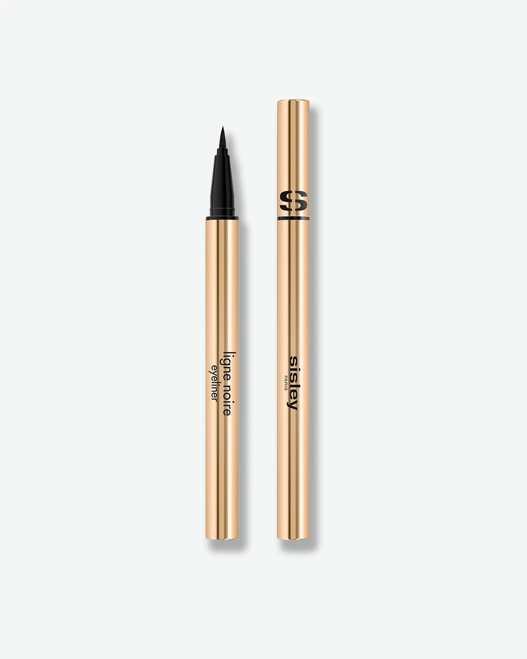 Eyeliner with gold casing and black tip on a white background