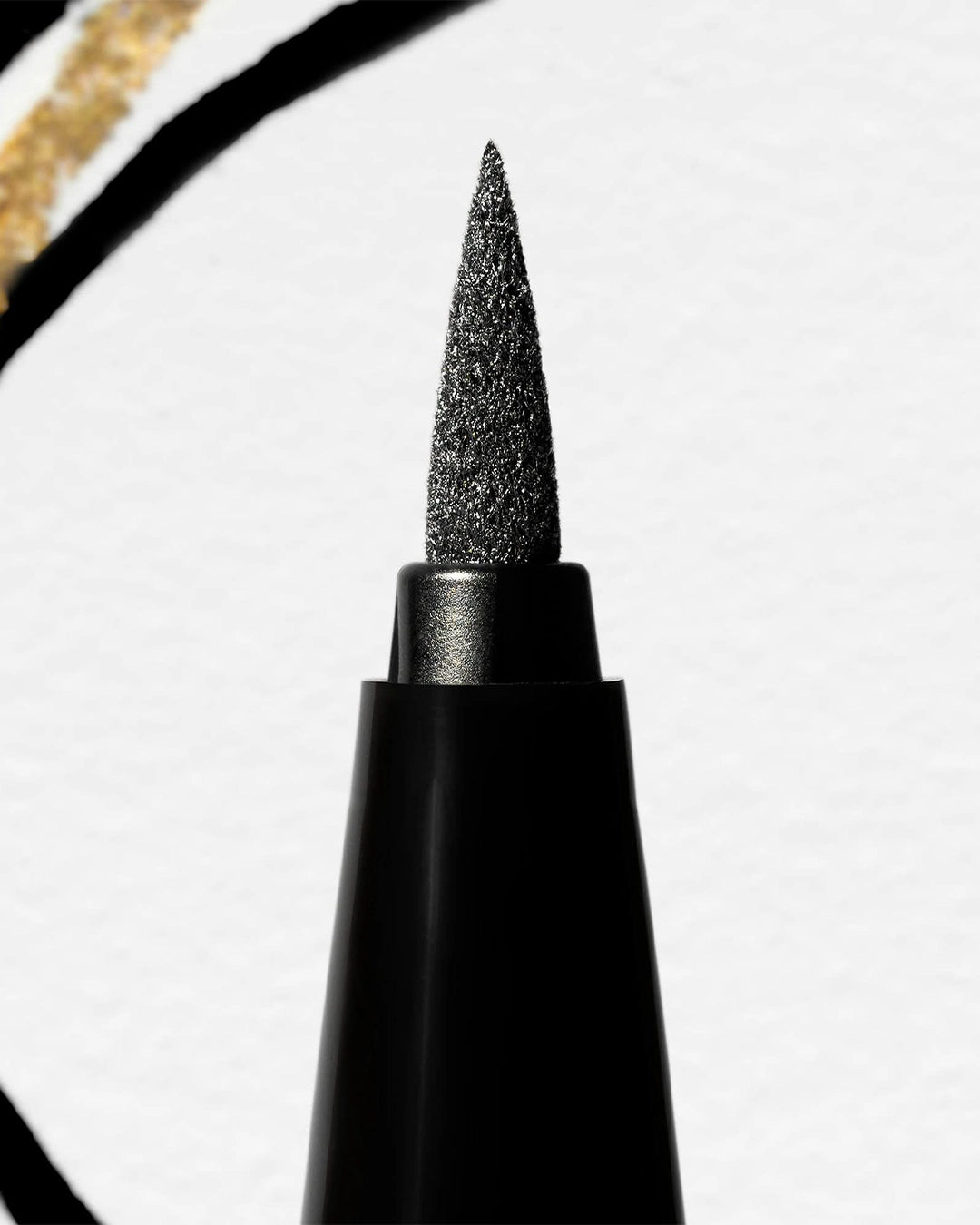 Black eyeliner pen with a pointed tip on a white background