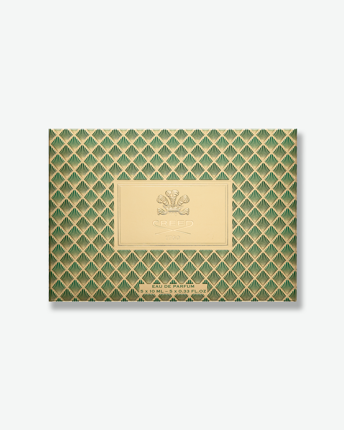 Creed Fragrance Discovery Set shown with its green and gold patterned gift box above an open tray containing five 10 mL fragrance sprays.