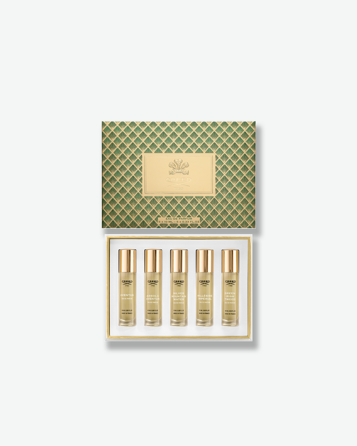 Creed Fragrance Discovery Set in a green and gold Art Deco patterned gift box with an embossed gold Creed logo at the center.