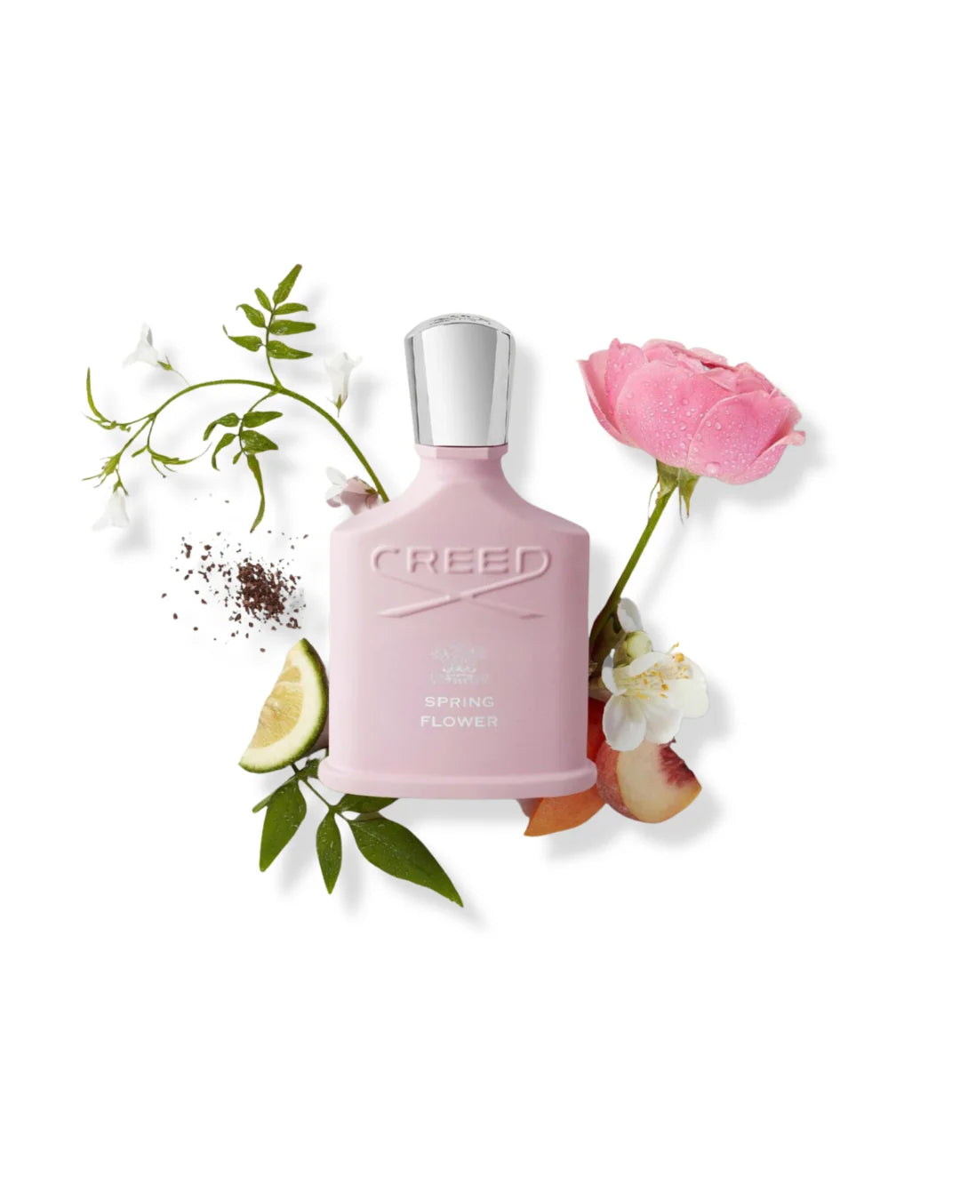 Pink Creed Spring Flower perfume bottle with silver cap, with flowers and fruit on a white background