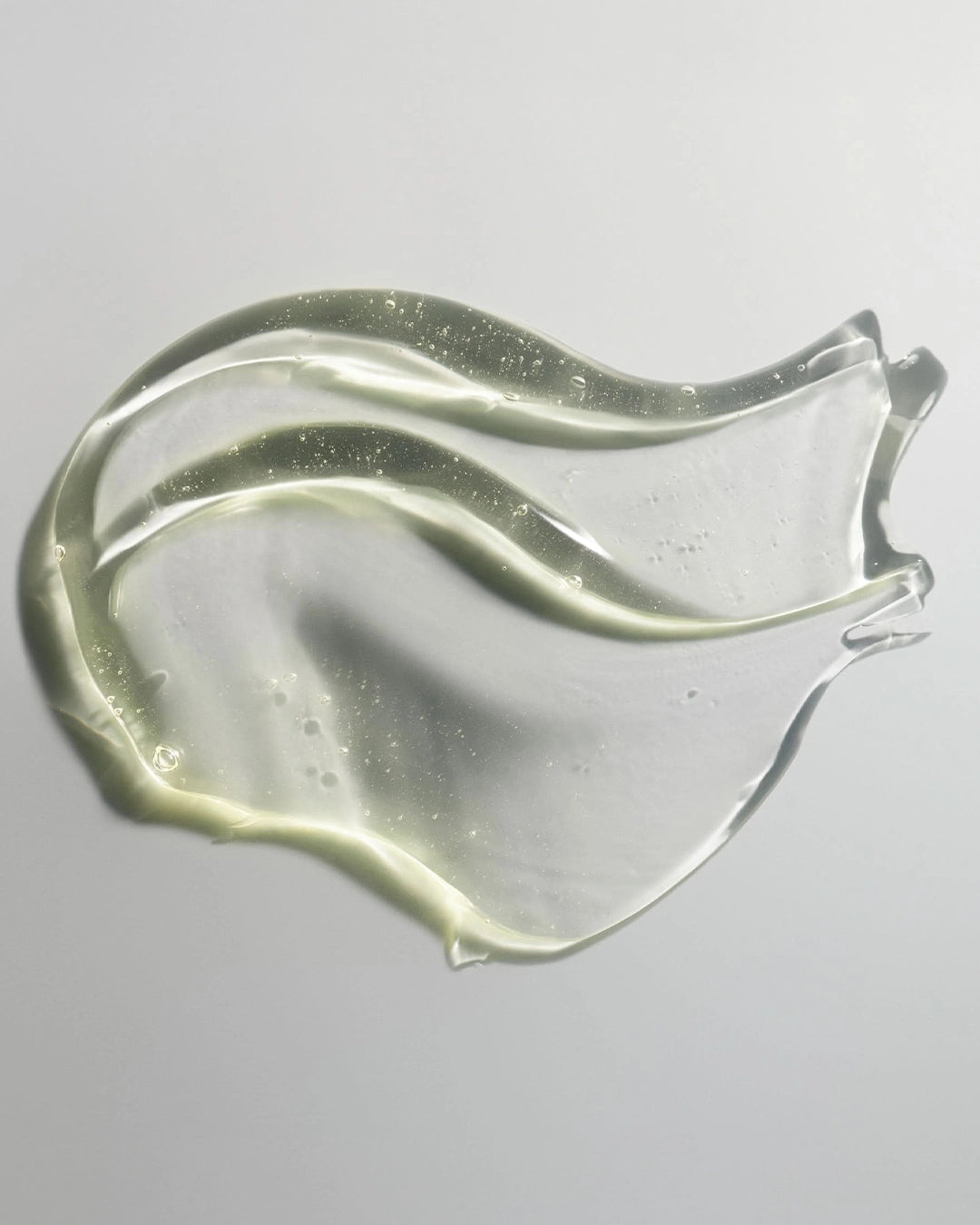 Clear gel-like substance on a gray background