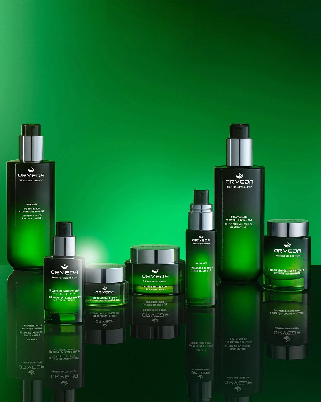 Collection of Orveda skincare products on a green background