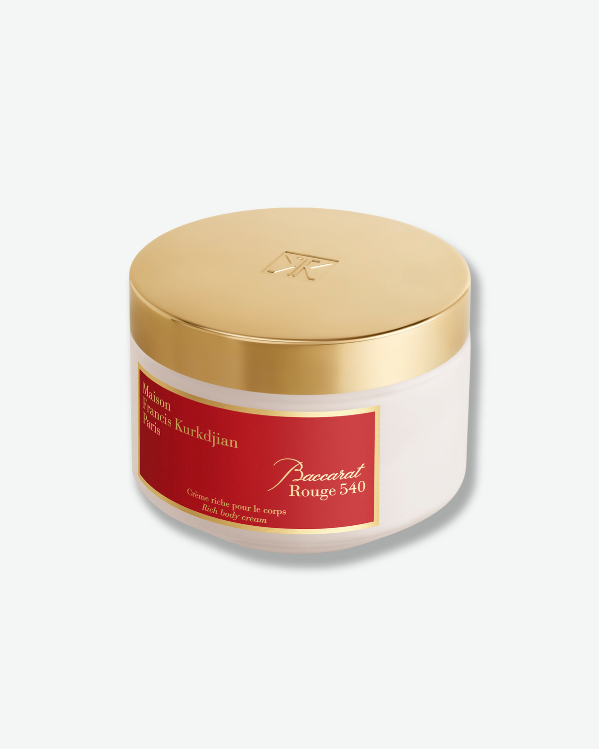 Maison Francis Kurkdjian Baccarat Rouge 540 Rich Body Cream shown at an angle in its frosted jar with a reflective gold lid embossed with the brand monogram.
