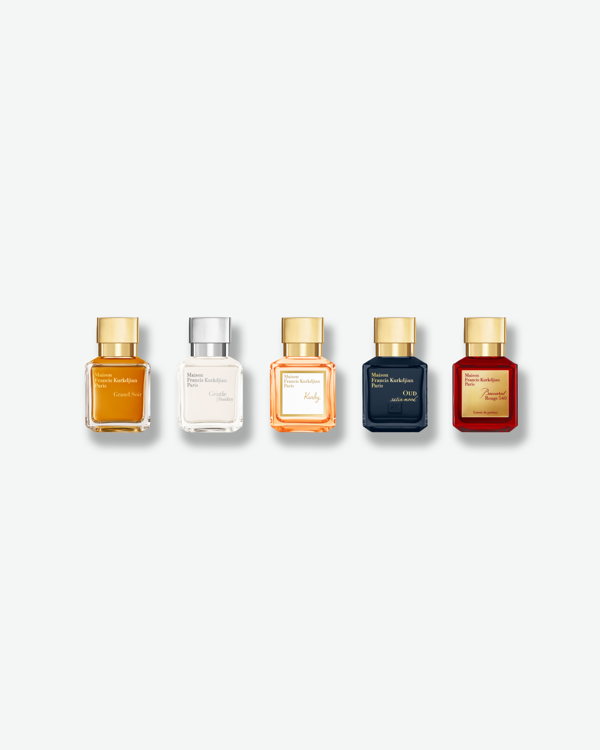 Maison Francis Kurkdjian Miniatures Set featuring five fragrances: Grand Soir, Gentle Fluidity, Kurky, Oud Satin Mood, and Baccarat Rouge 540, displayed in colorful glass bottles with metallic caps.