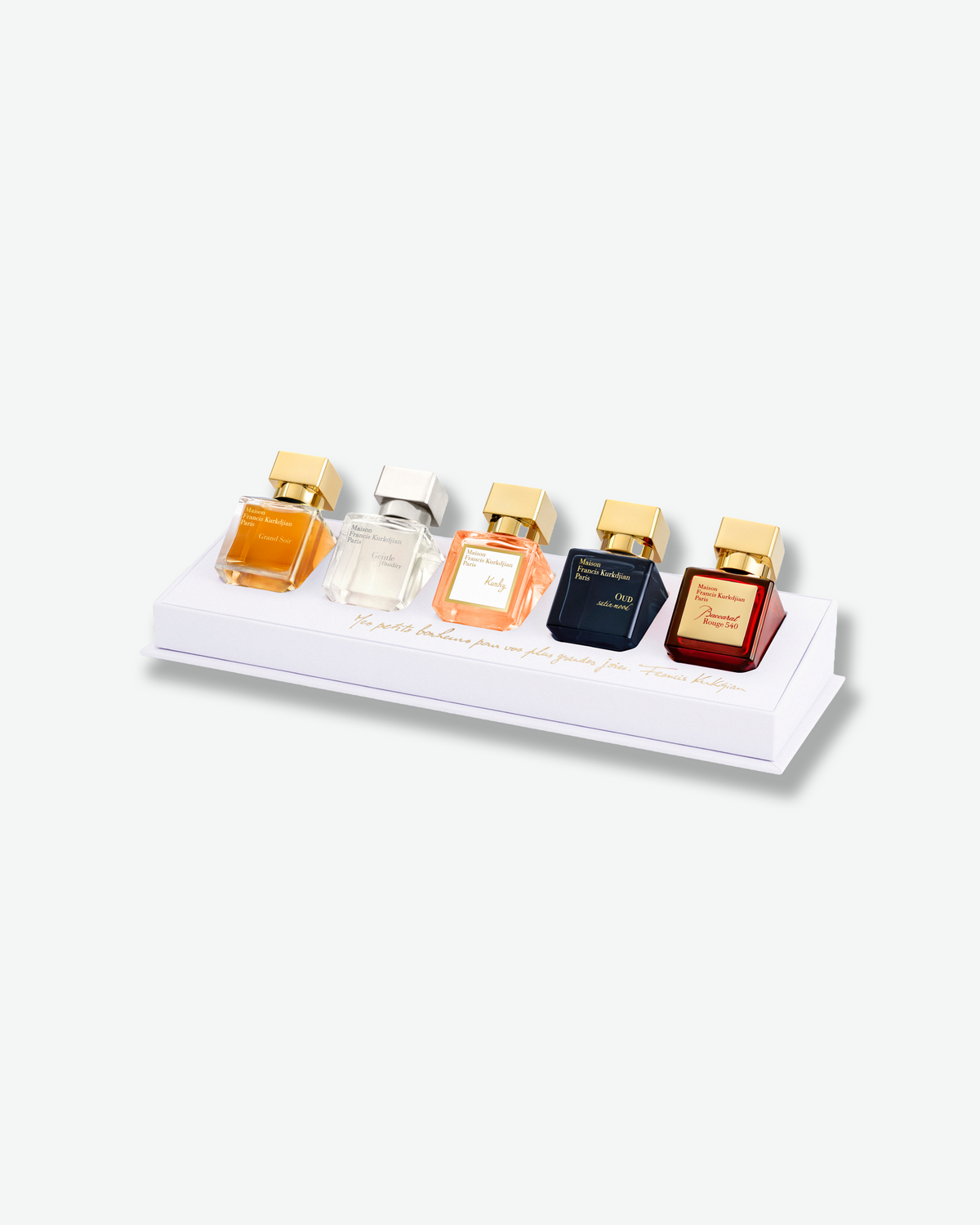 Maison Francis Kurkdjian Miniatures Set featuring five fragrances displayed at an angle on a white presentation tray with gold script detailing.