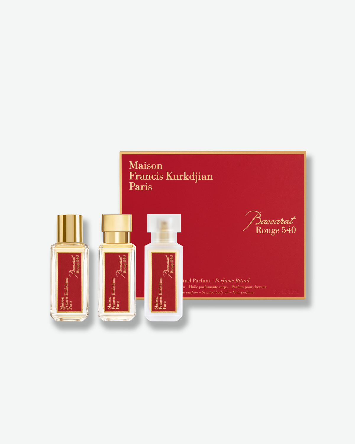 Maison Francis Kurkdjian Baccarat Rouge 540 fragrance ritual set featuring three bottles displayed in front of a red gift box with gold lettering.
