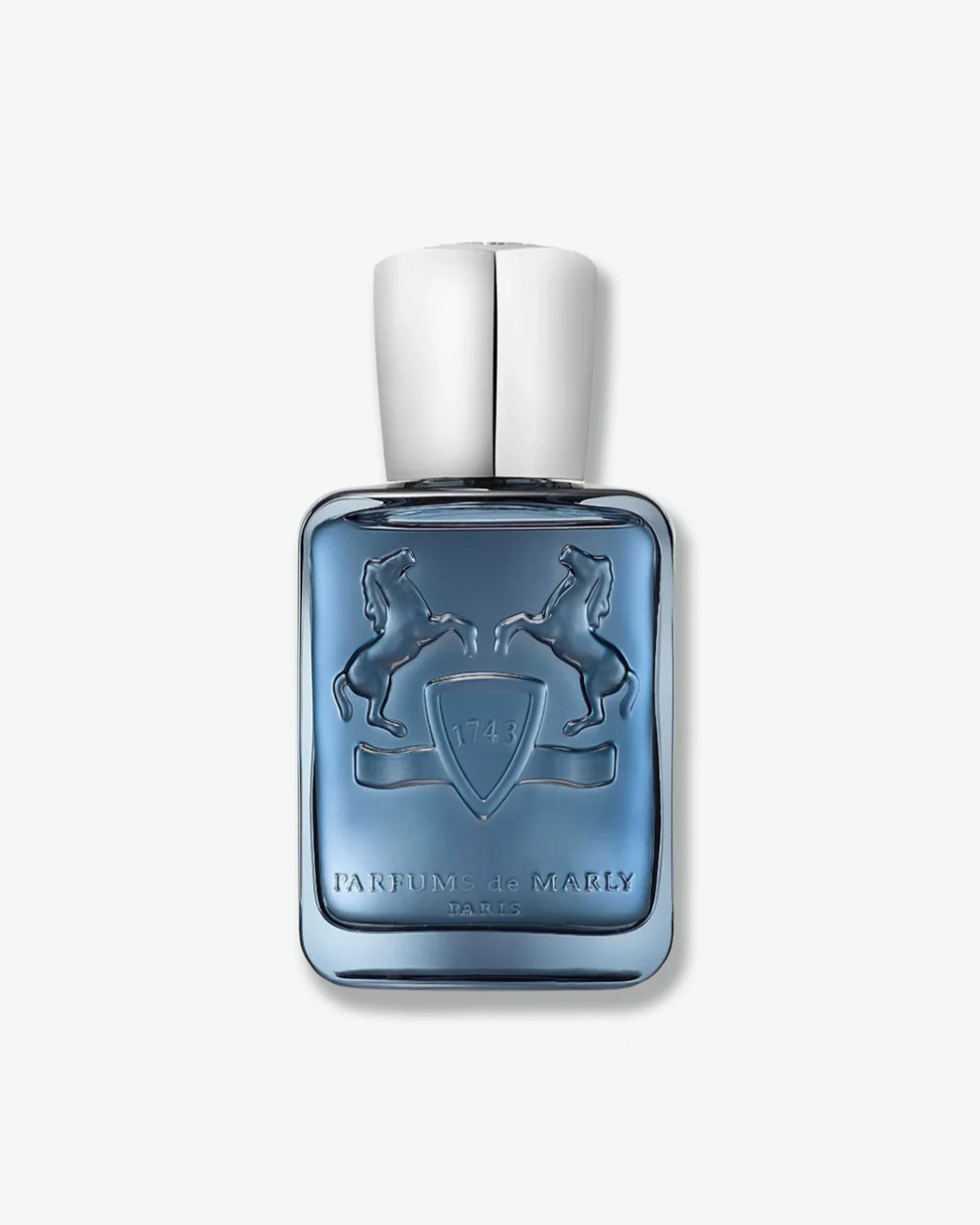Blue perfume bottle with silver cap on a white background