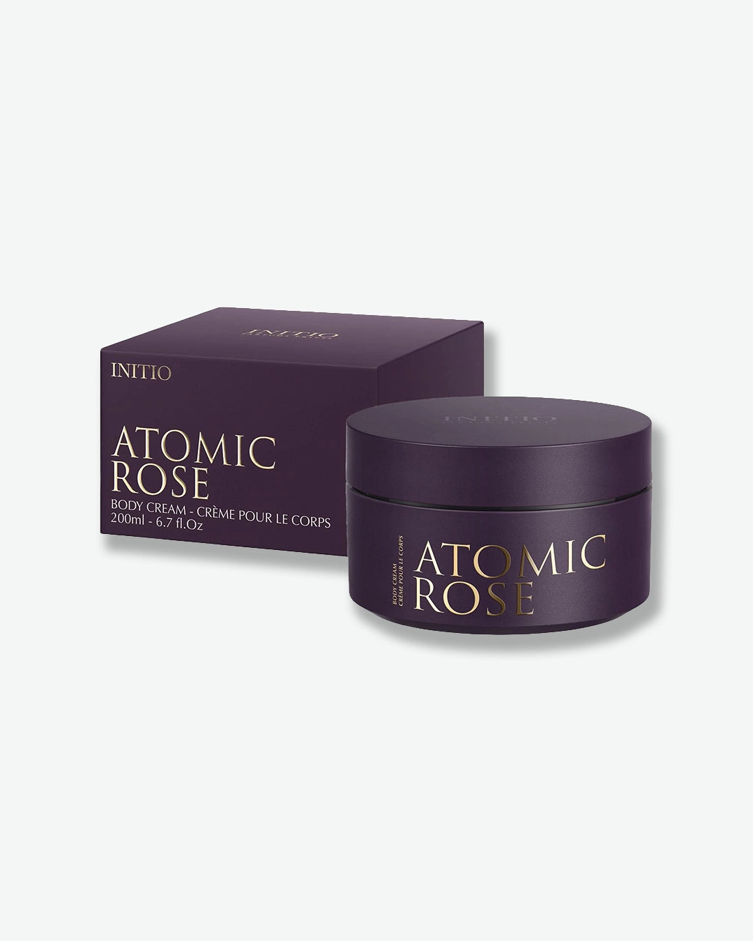 Purple 'Atomic Rose' body cream jar and packaging on a white background