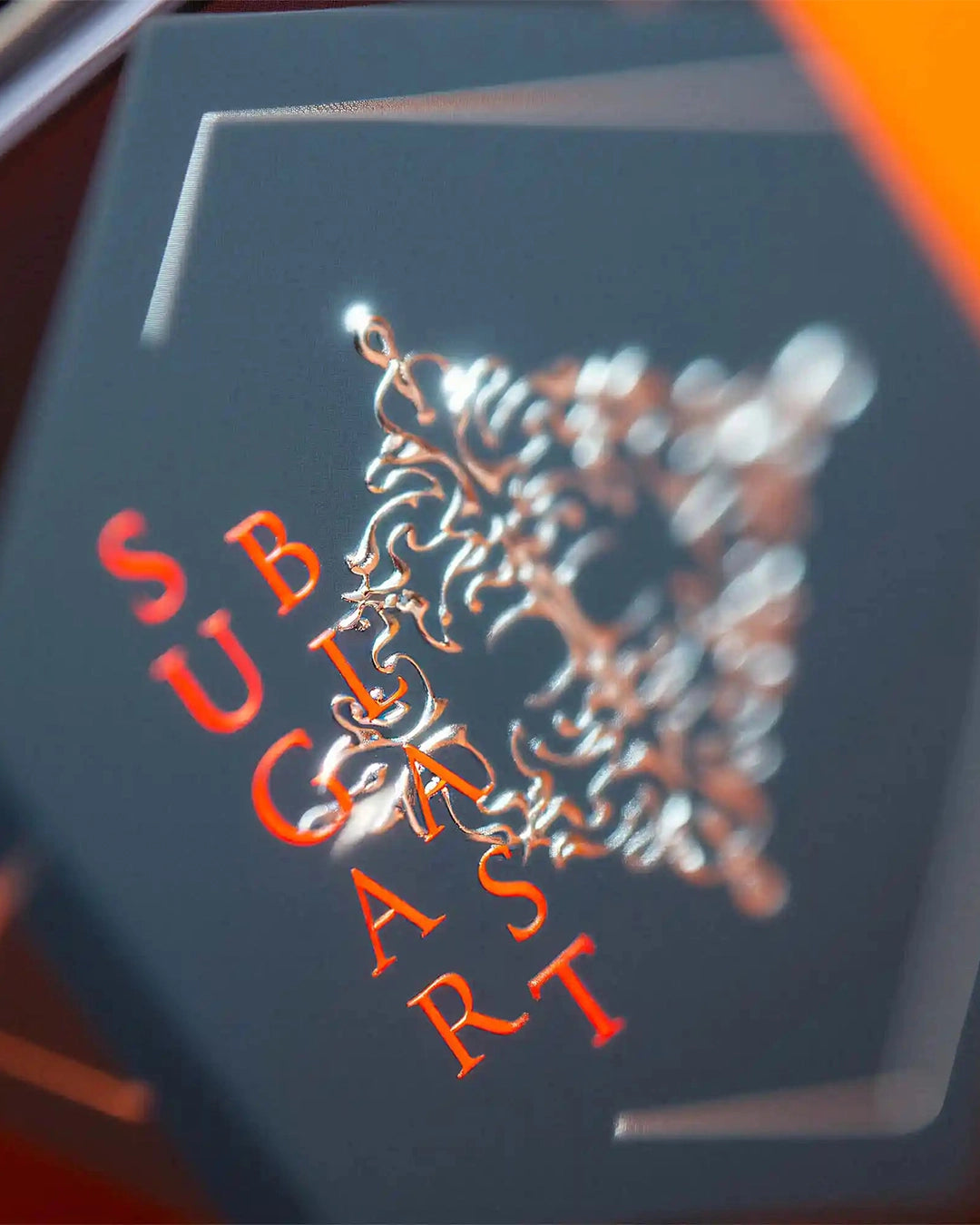 Close-up of a dark blue box with 'SUGAR BLAST' scent in red and gold.