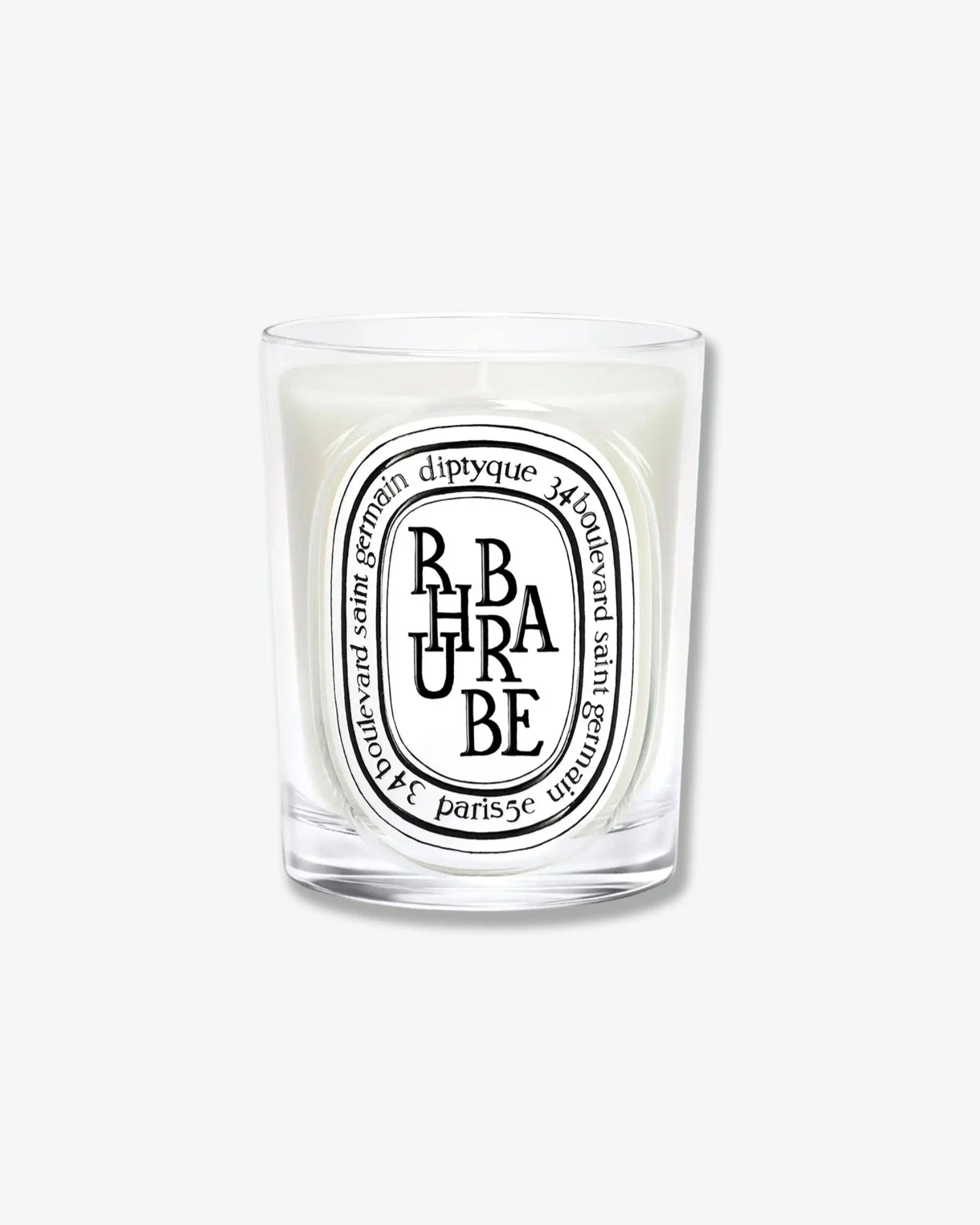 Diptyque Rhubarbe scented candle in a classic clear glass jar featuring the signature white oval logo with black lettering, isolated on a light grey background.