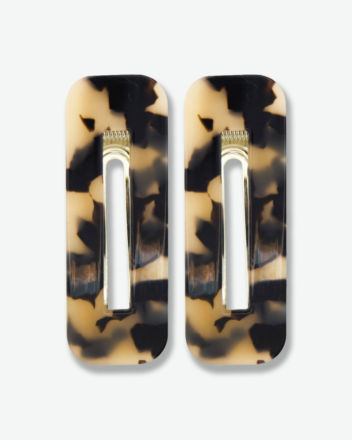 Set of two rectangular tortoiseshell hair clips featuring glossy beige and black marbled patterns with gold-tone metal clasps, displayed against a white background.