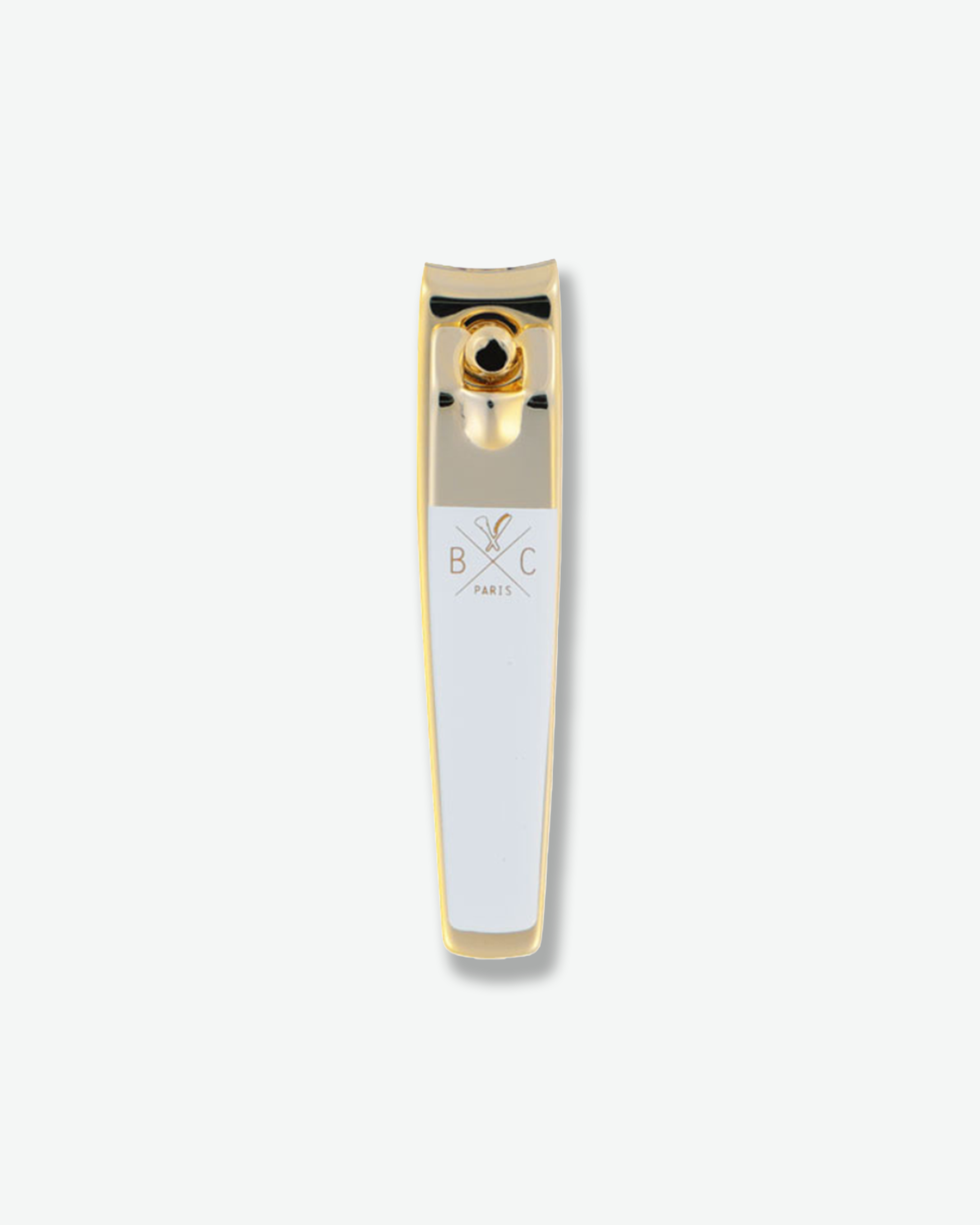 Luxury gold and white nail clippers isolated on a plain white background.