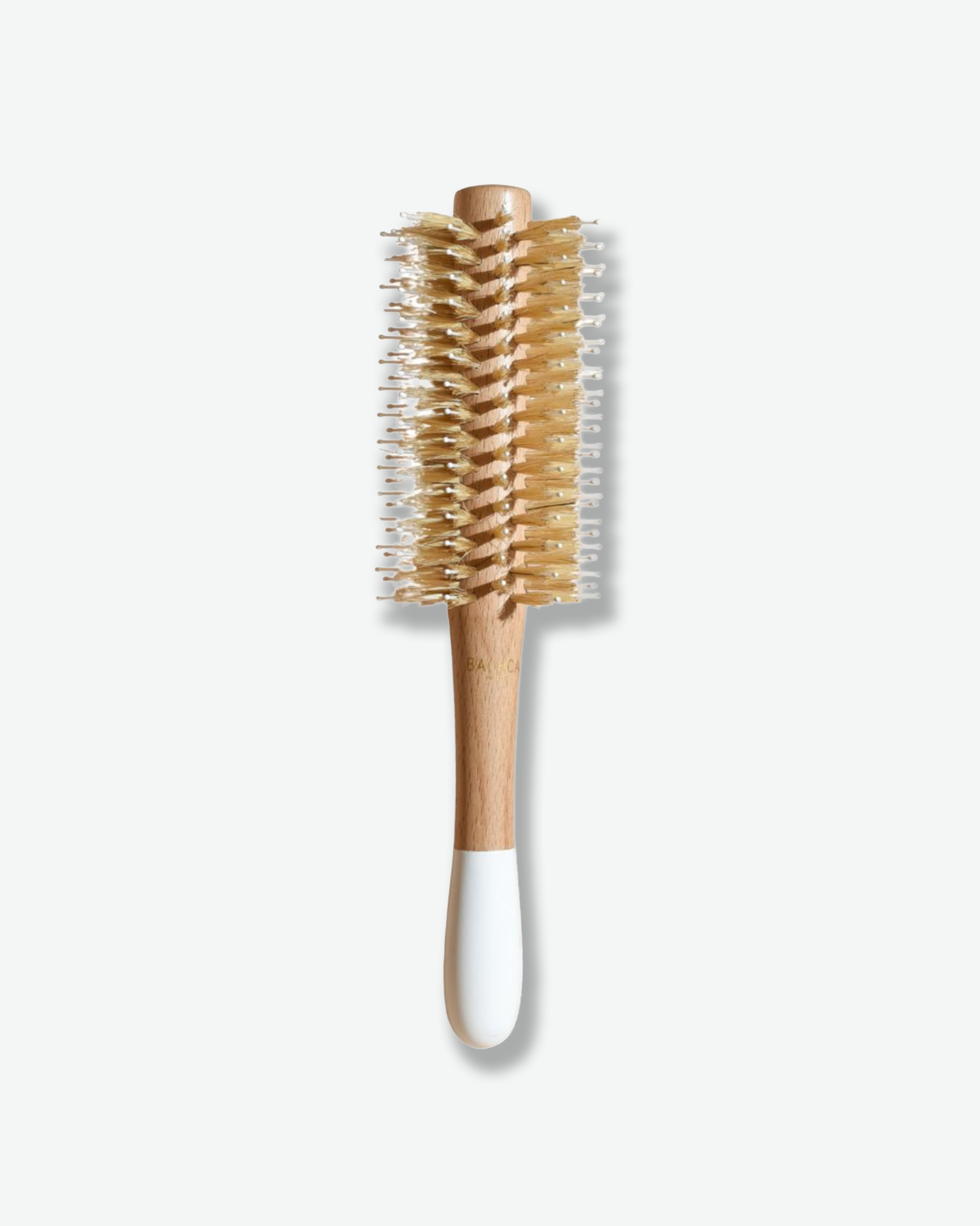 Hairbrush with wooden handle and bristle head on a white background