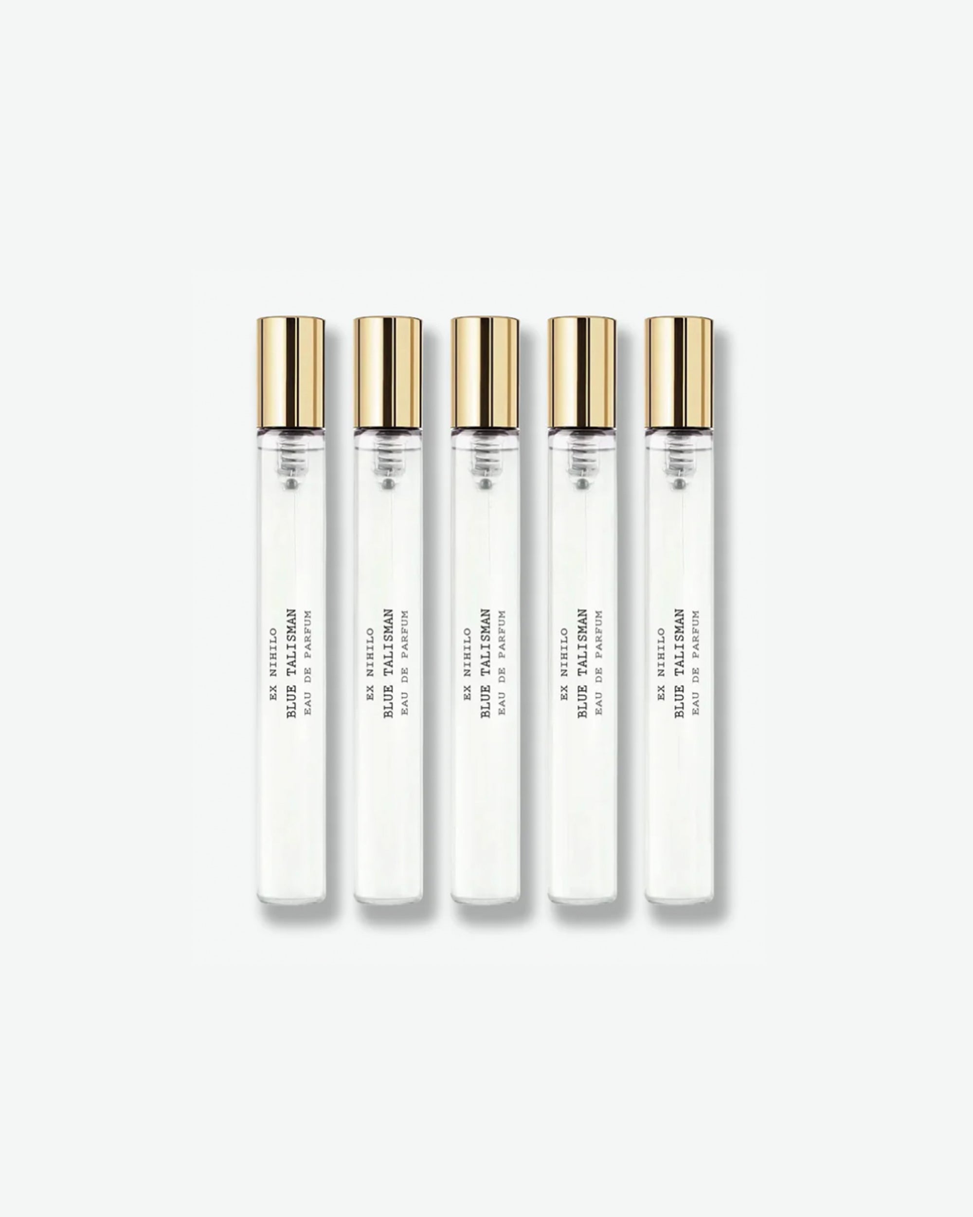 A set of five identical Ex Nihilo Blue Talisman Eau de Parfum travel spray vials with clear glass bodies and gold caps, arranged vertically against a light grey background.
