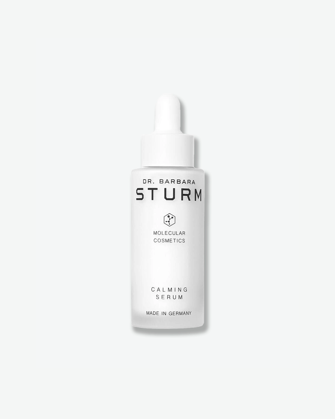 A product shot of a Dr. Barbara Sturm Calming Serum bottle, centered against a light gray background. The bottle is made of frosted white glass and is topped with a white rubber dropper bulb assembly. The clean black text on the front reads "DR. BARBARA STURM", the molecular hexagon logo, "MOLECULAR COSMETICS", "CALMING SERUM", and "MADE IN GERMANY".