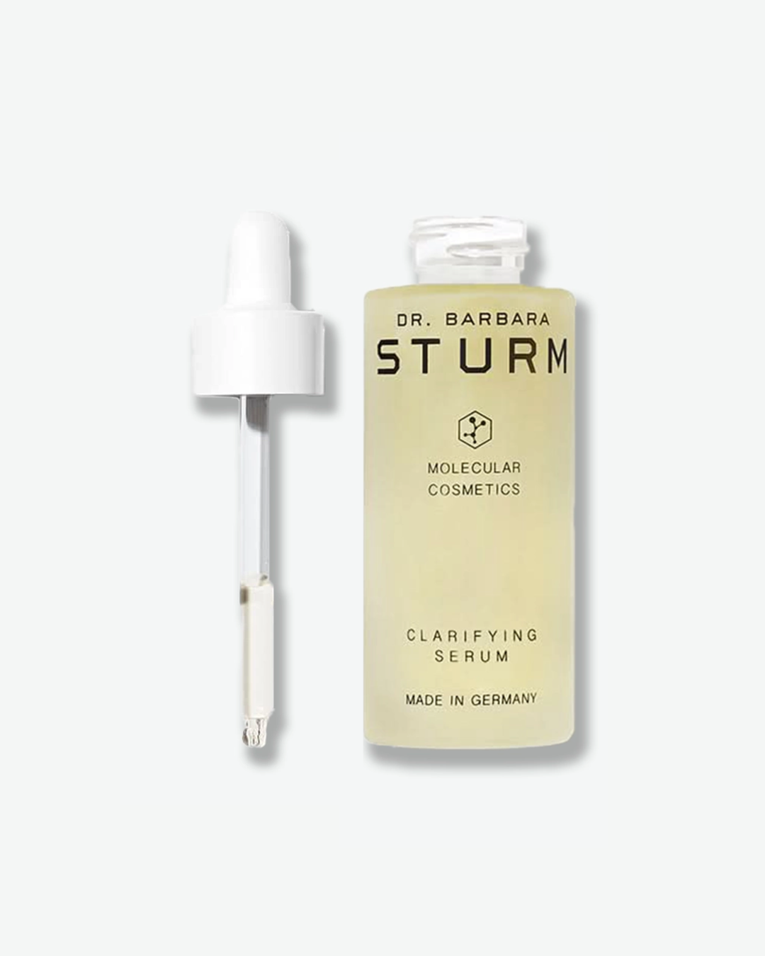 A closed bottle of Dr. Barbara Sturm Clarifying Serum, centered against a light gray background. The frosted glass bottle clearly displays the light yellow hue of the translucent serum inside and is topped with a white rubber dropper bulb cap. The front text reads "CLARIFYING SERUM".