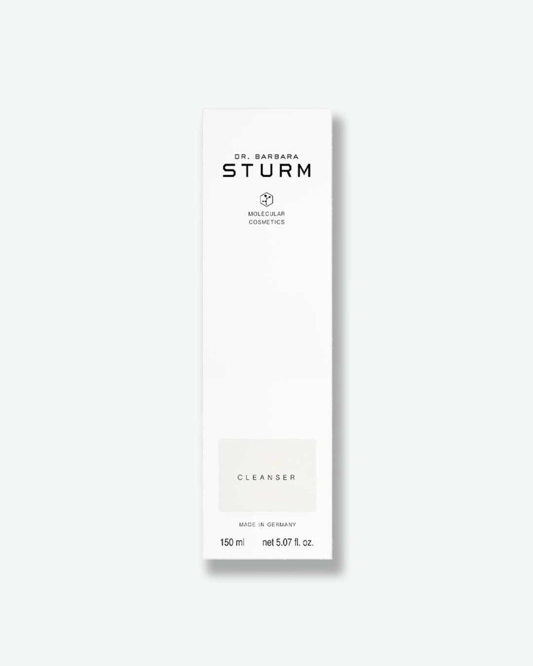 A product shot of the tall, white cardboard packaging box for the Dr. Barbara Sturm Cleanser, centered against a light gray background. It features the same minimalist black branding as the bottle, with a light gray rectangle highlighting the text "CLEANSER". The bottom lists "MADE IN GERMANY" and the volume "150 ml net 5.07 fl. oz."