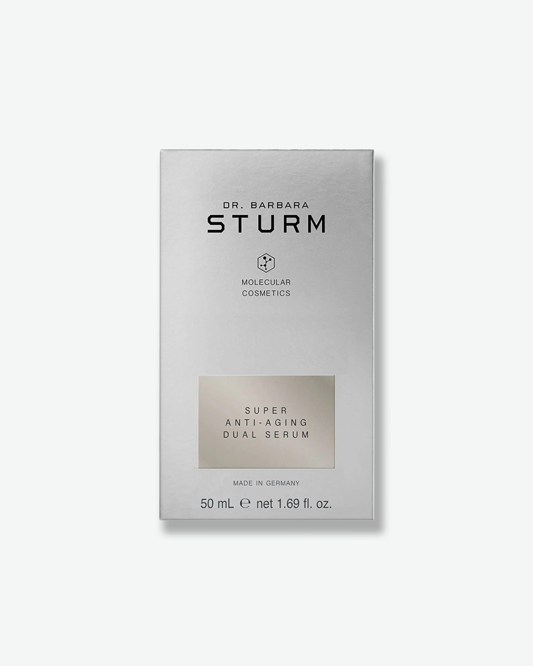A product shot of the silver cardboard packaging box for the Dr. Barbara Sturm Super Anti-Aging Dual Serum, centered against a light gray background. It features black branding text and a slightly darker silver rectangle highlighting the product name. The bottom indicates "MADE IN GERMANY" and the volume "50 mL e net 1.69 fl. oz."