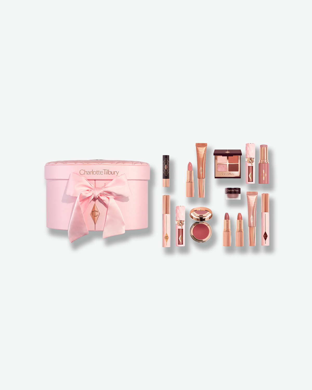 Charlotte Tilbury Pillow Talk Beauty Soulmates makeup set with pink vanity case and assorted makeup products.