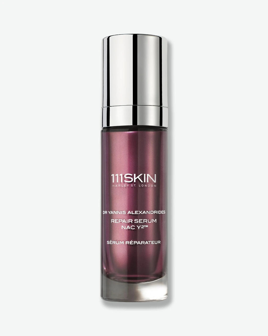 Product image of the 111SKIN Repair Serum NAC Y² displayed against a light gray background. The serum is housed in a sleek plum-colored bottle with a reflective silver cap and white branding, showcasing the brand’s signature treatment designed to support skin repair, hydration, and a healthier-looking complexion.