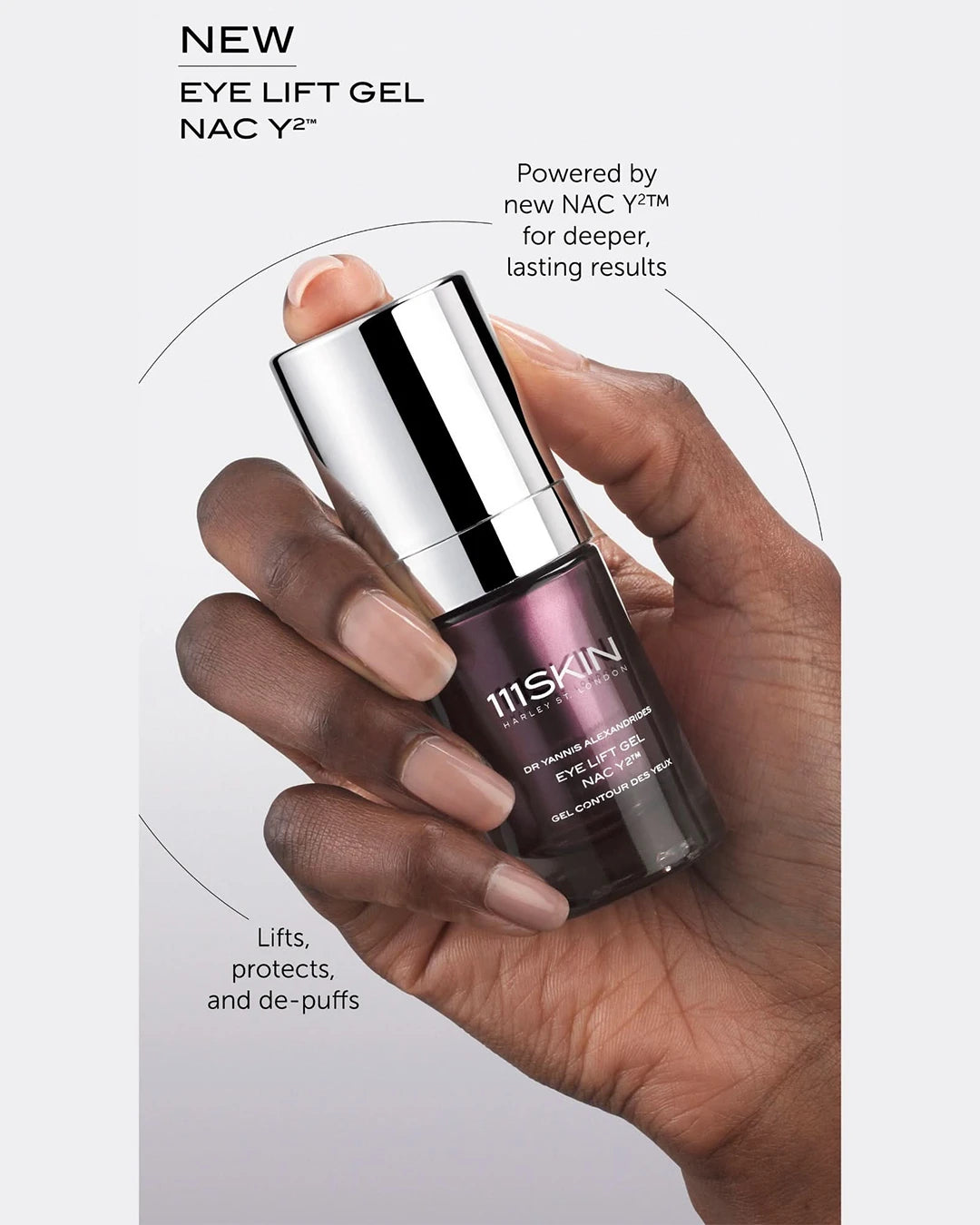 Hand holding a 111SKIN eye lift gel bottle with product details on a light gray background