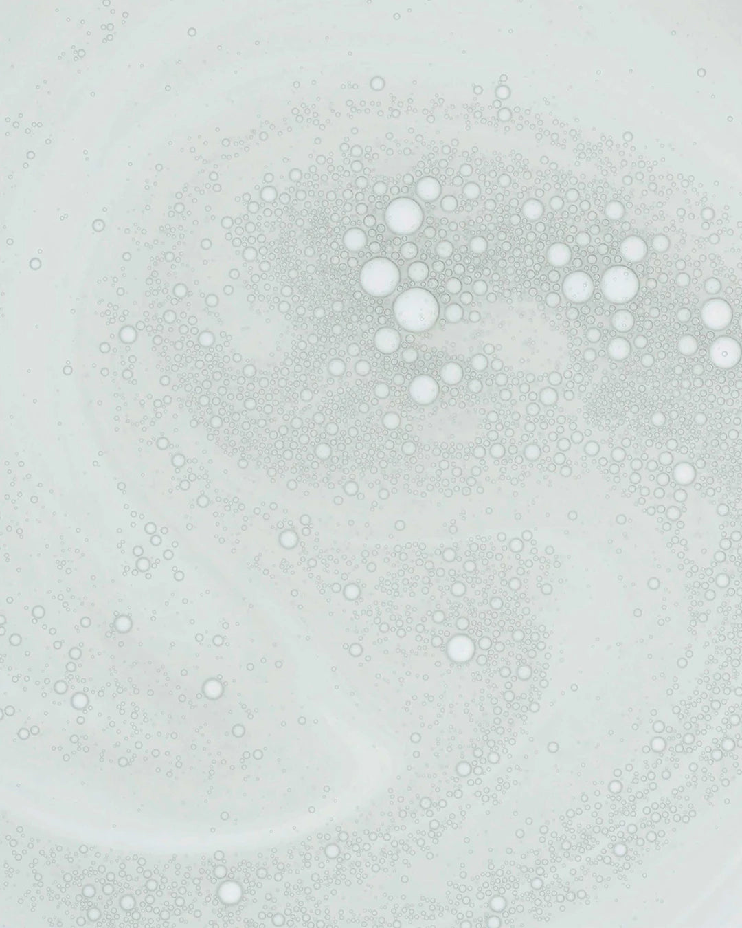 Pattern of small bubbles on a light gray background