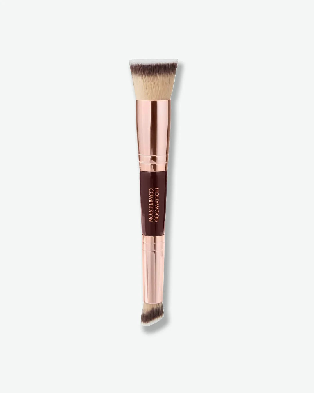 Dual-ended makeup brush with rose gold handle on a white background