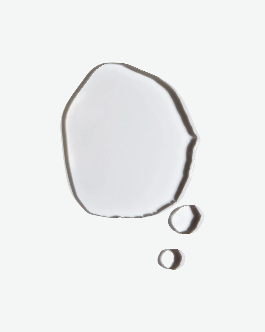 Two water droplets on a white background
