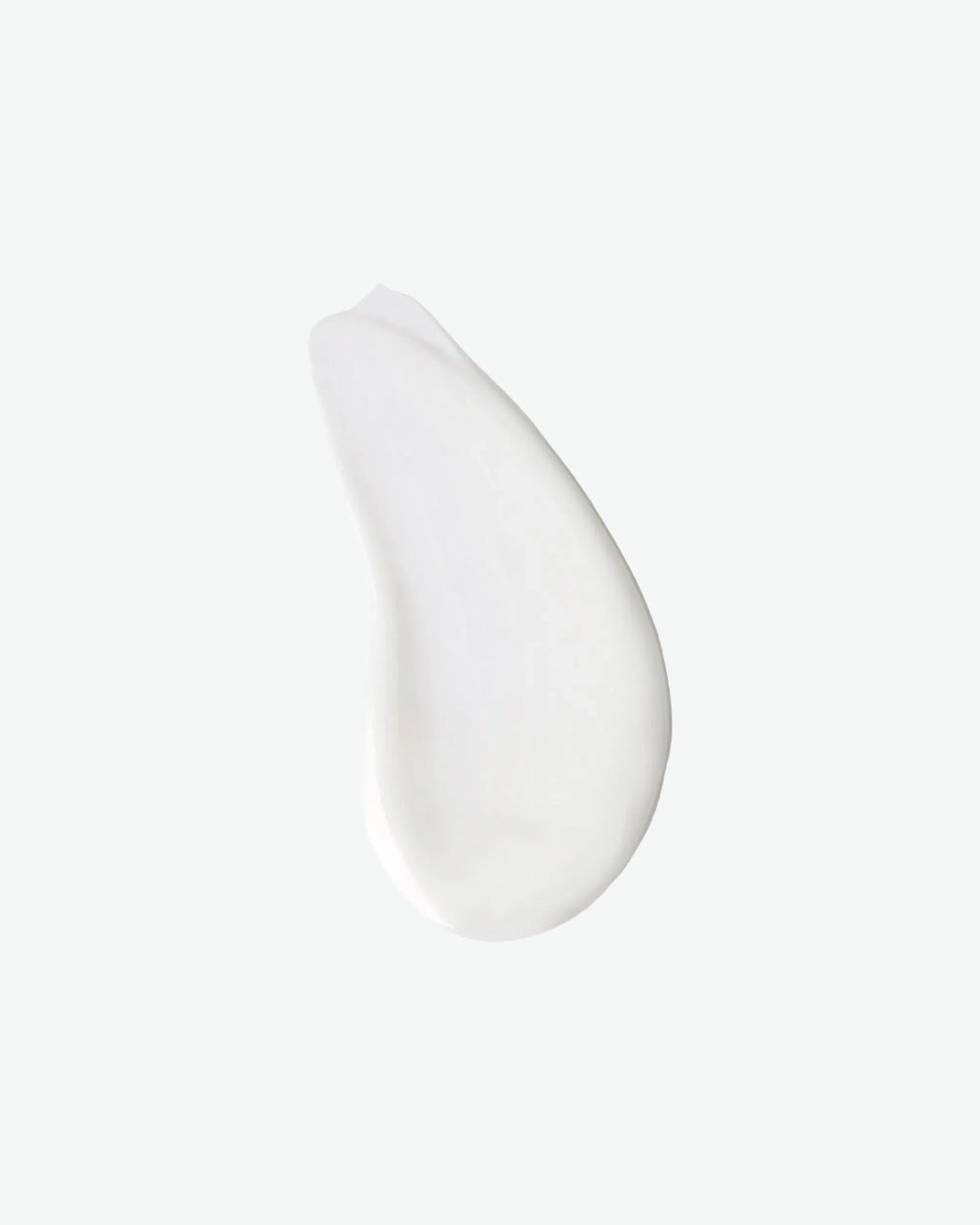 White ceramic teardrop-shaped plate on a light gray background