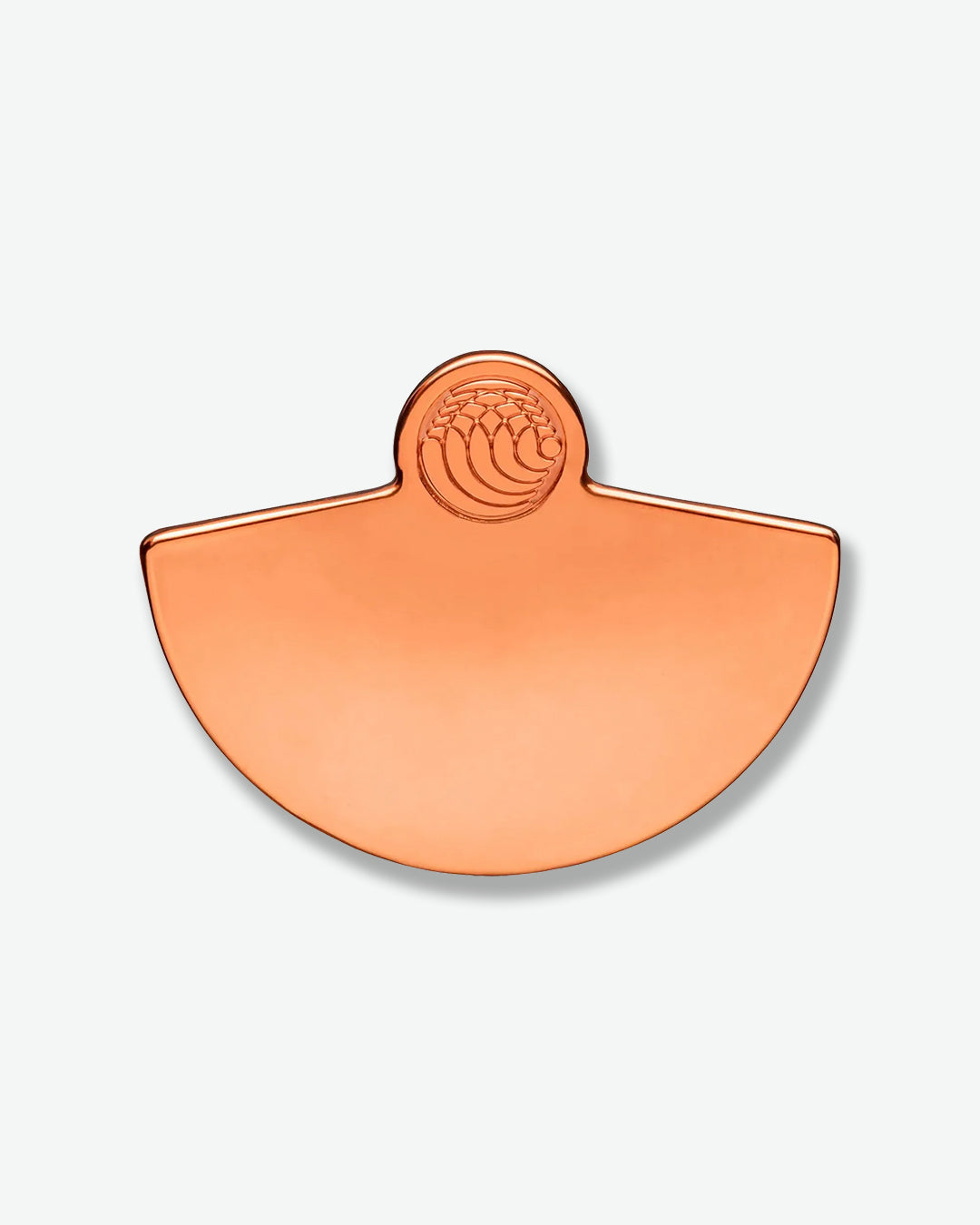 Copper-colored half-circle object with a central emblem on a white background