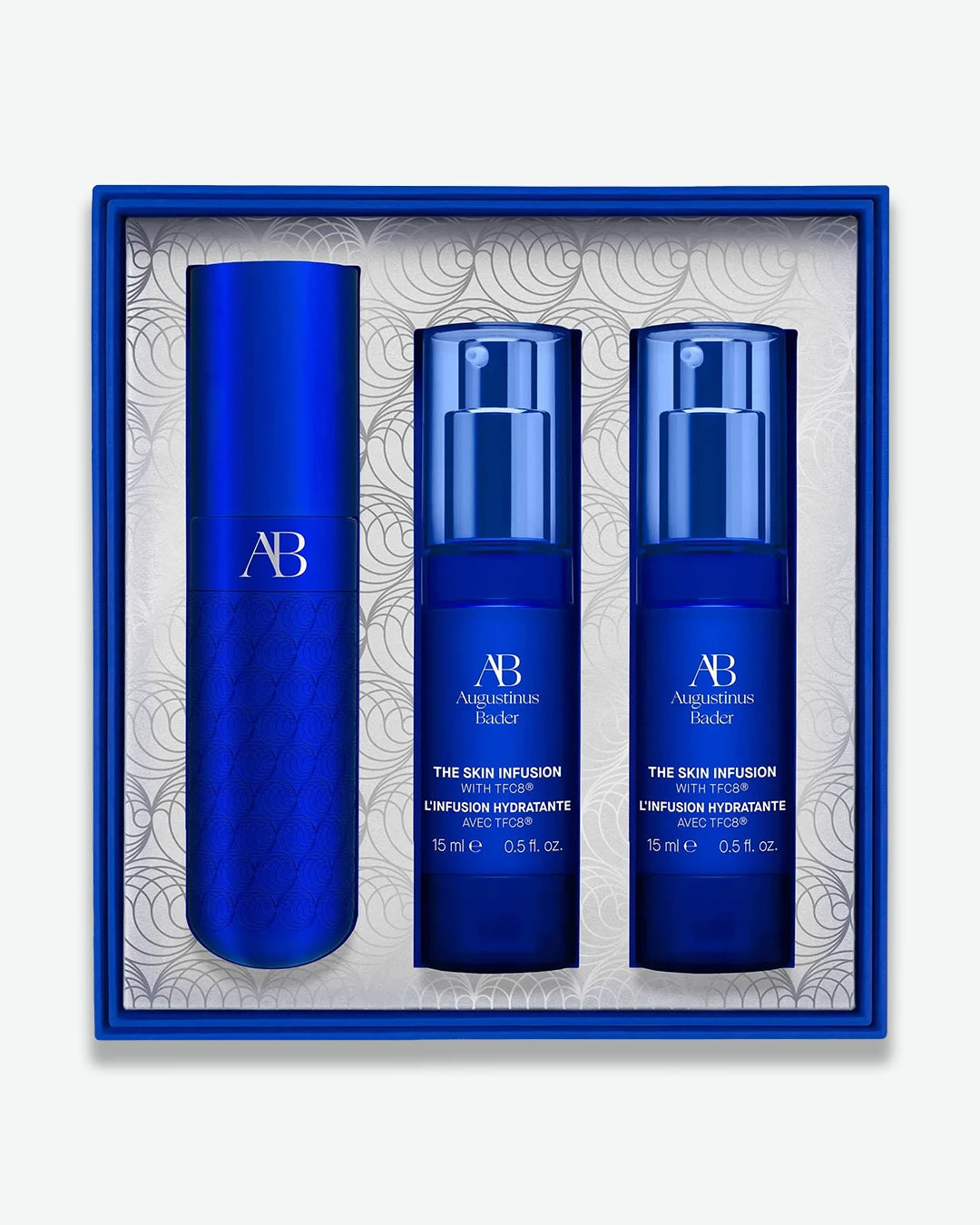 Set of three blue skincare bottles with 'AB' branding in a decorative box.