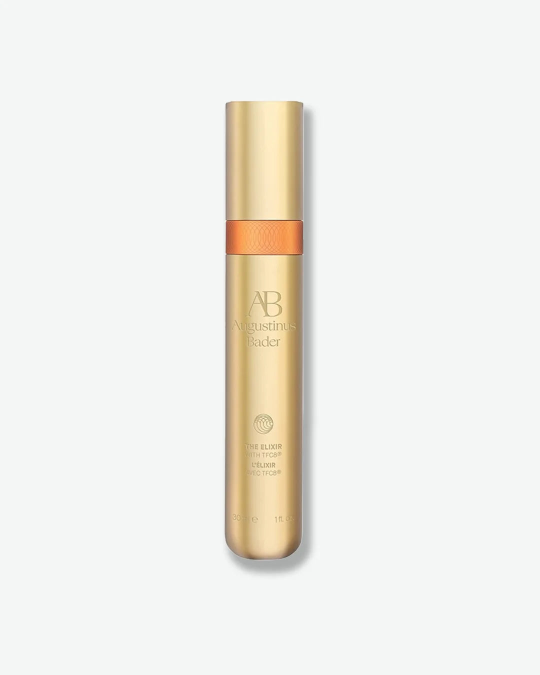 Skinny gold Augustinus Bader The Elixer vial, centered against a light grey background.