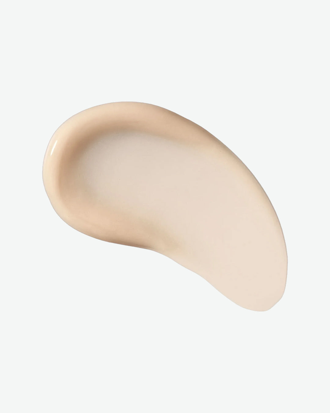 Beige cosmetic product swatch on a light gray background