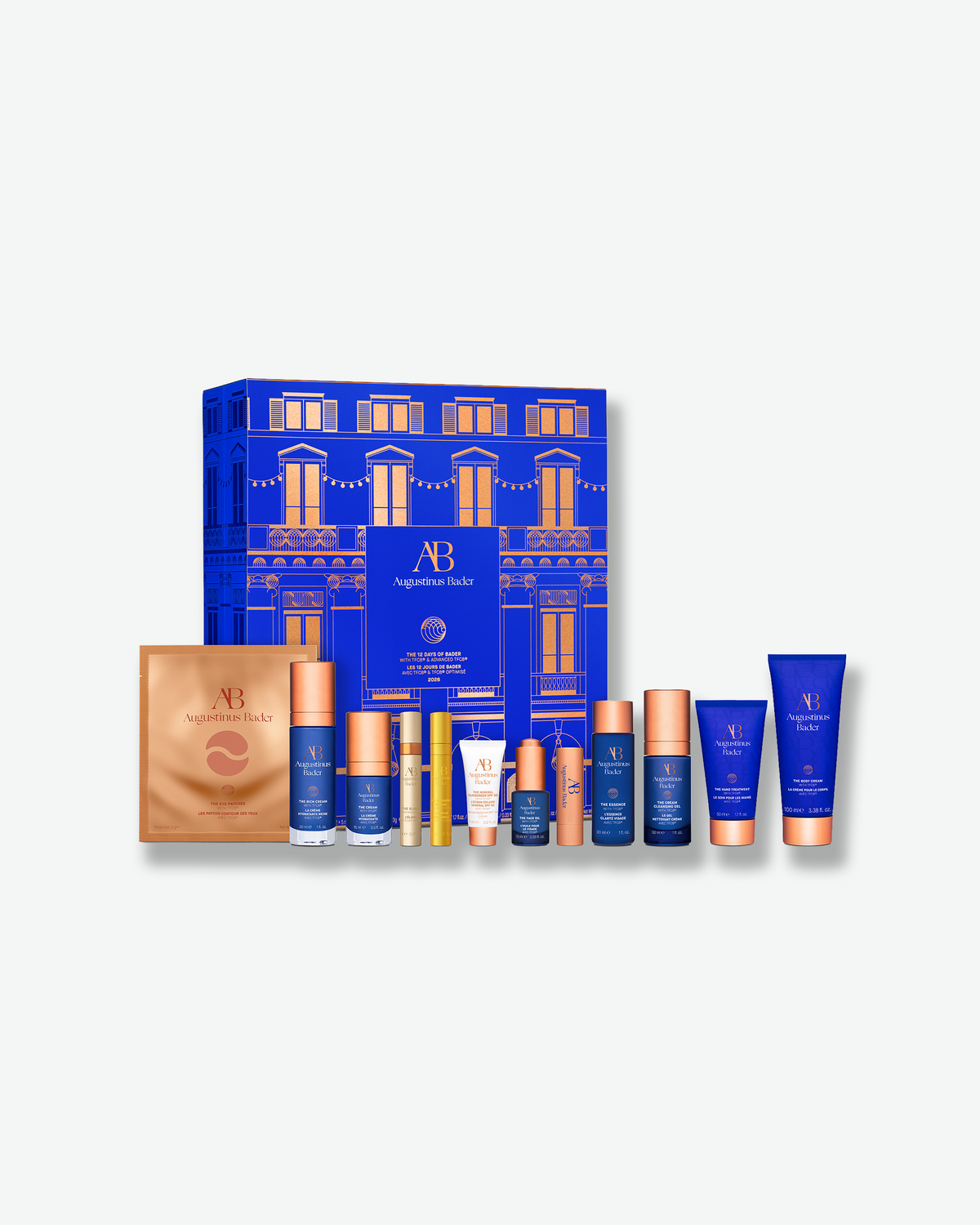 Augustinus Bader The 12 Days of Bader advent calendar with a full assortment of skincare products displayed in front of the blue illustrated gift box.