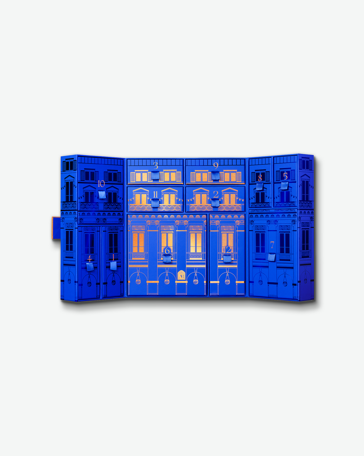 Open Augustinus Bader The 12 Days of Bader advent calendar showing the numbered blue and copper holiday compartments.