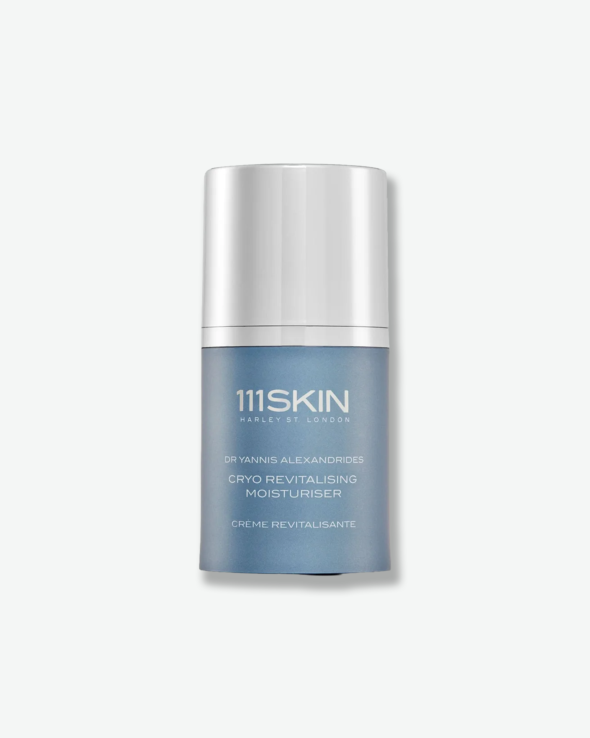 Front view of a 111SKIN Cryo Revitalising Moisturiser container against a plain gray background. The sleek, cylindrical bottle features a matte, steel-blue metallic finish with silver printed text branding and is capped with a tall, matching silver metallic cylindrical over-cap.