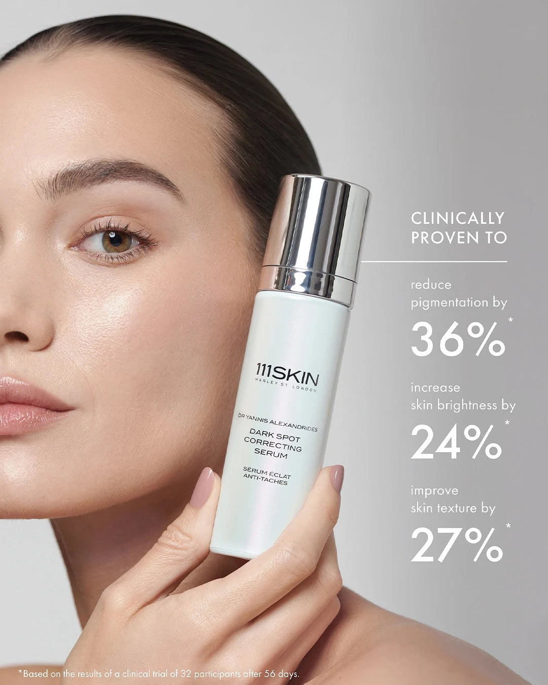 Woman holding a skincare product with clinical benefits displayed on a gray background