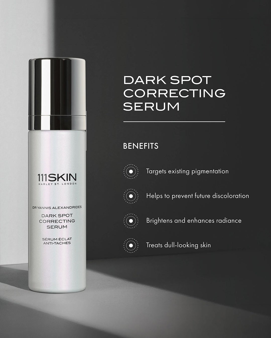 111SKIN dark spot correcting serum bottle with benefits listed on a gray background