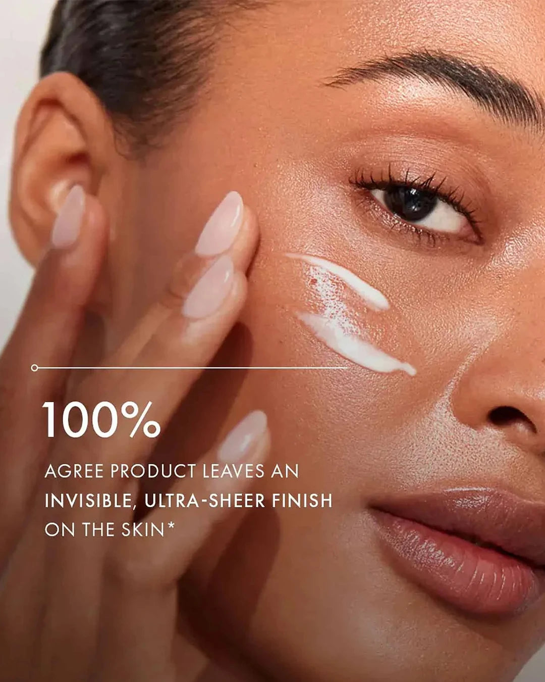 Woman applying cream to her face with text about product finish