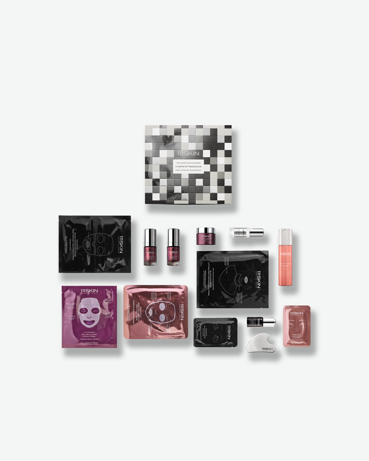 111SKIN 11 Days of Radiance holiday skincare set featuring masks, serums, moisturizers, eye care, and a facial massage tool.