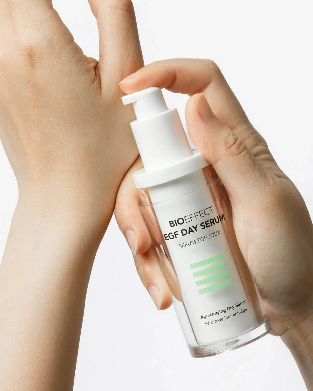 Hand holding a Bioeffect EGF Day Serum bottle against a neutral background
